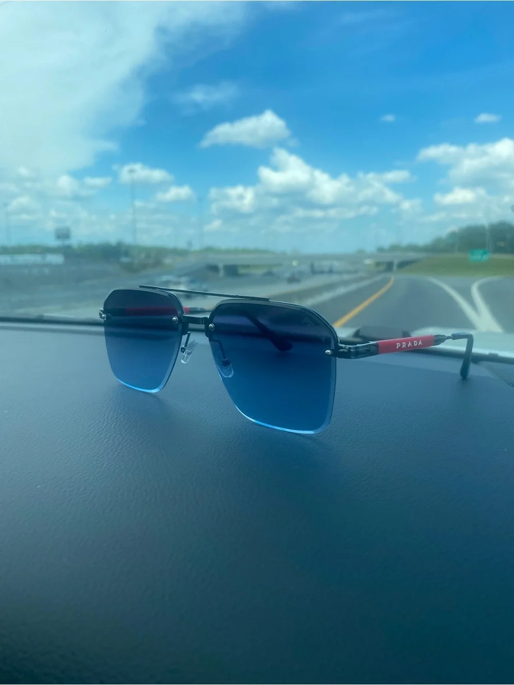 Prada Blue Gradient Rimless Sunglasses with Red Temples